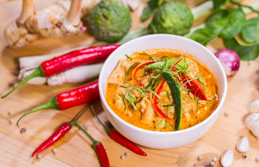 Thailand Food Curry pork spicy on wood table. Thailand call Panang.